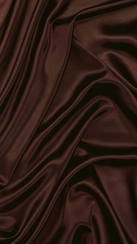 Surrender To The Soothing Embrace Of The Dark Brown Aesthetic Wallpaper