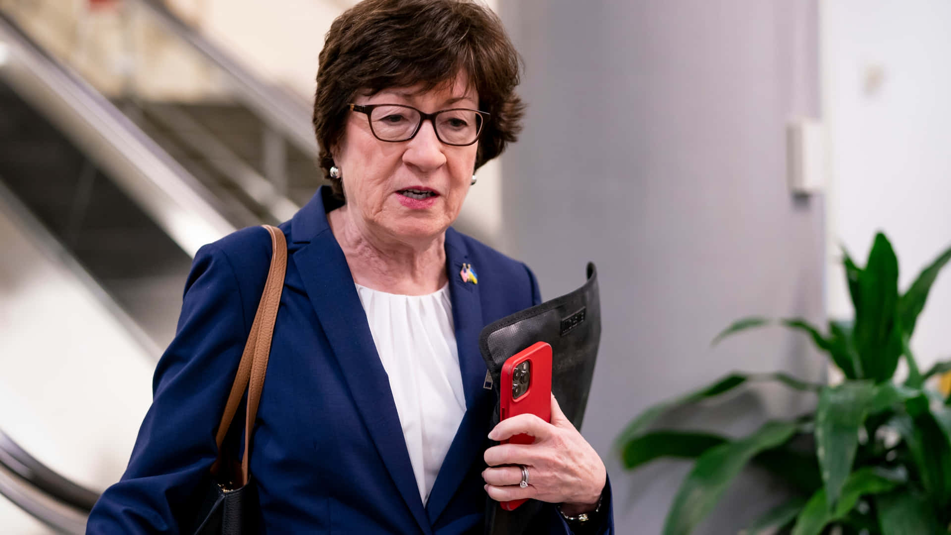 Susan Collins Holding iPhone Wallpaper