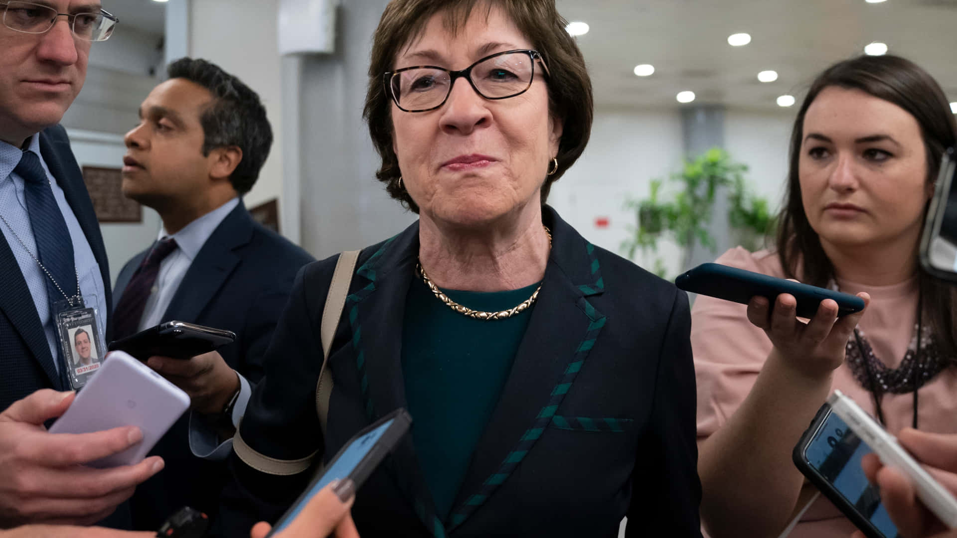 Susan Collins With Reporters Wallpaper