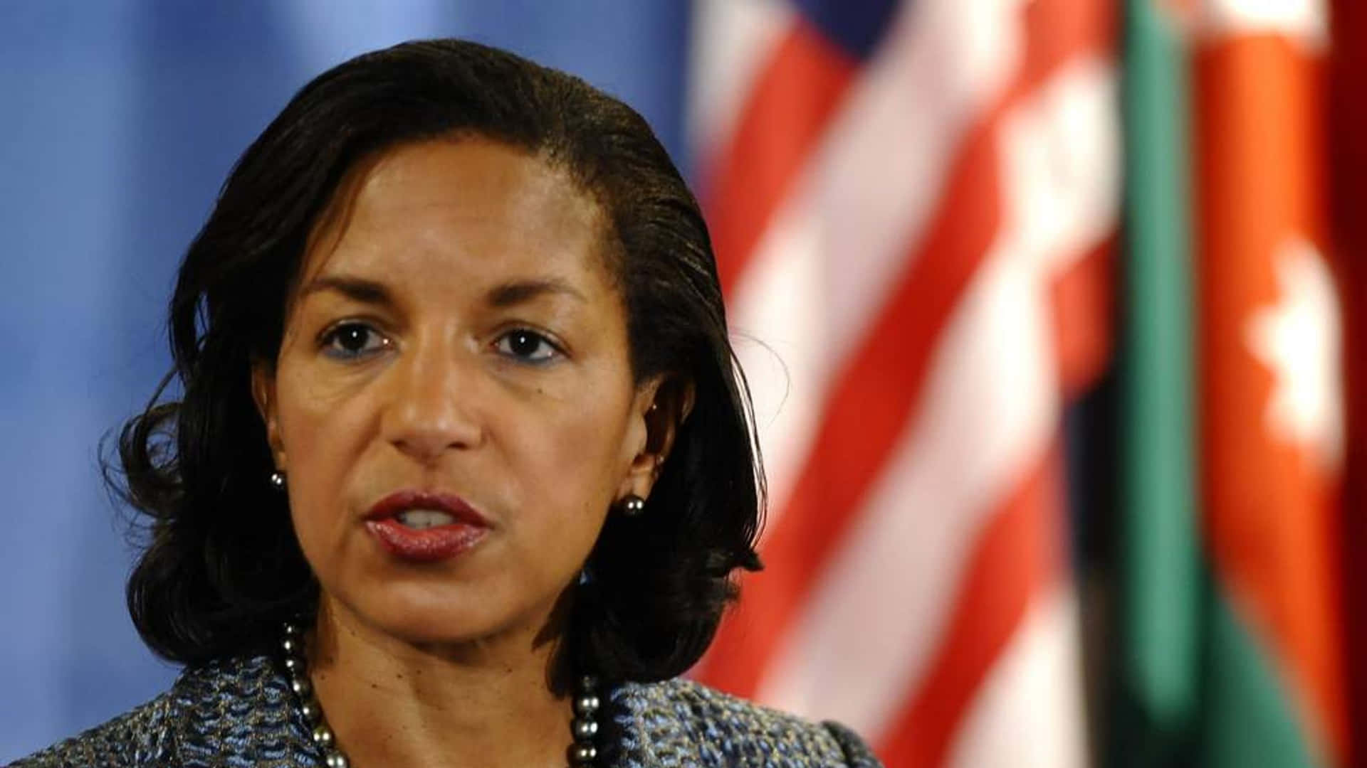 Susan Rice Speakingwith Flags Background Wallpaper