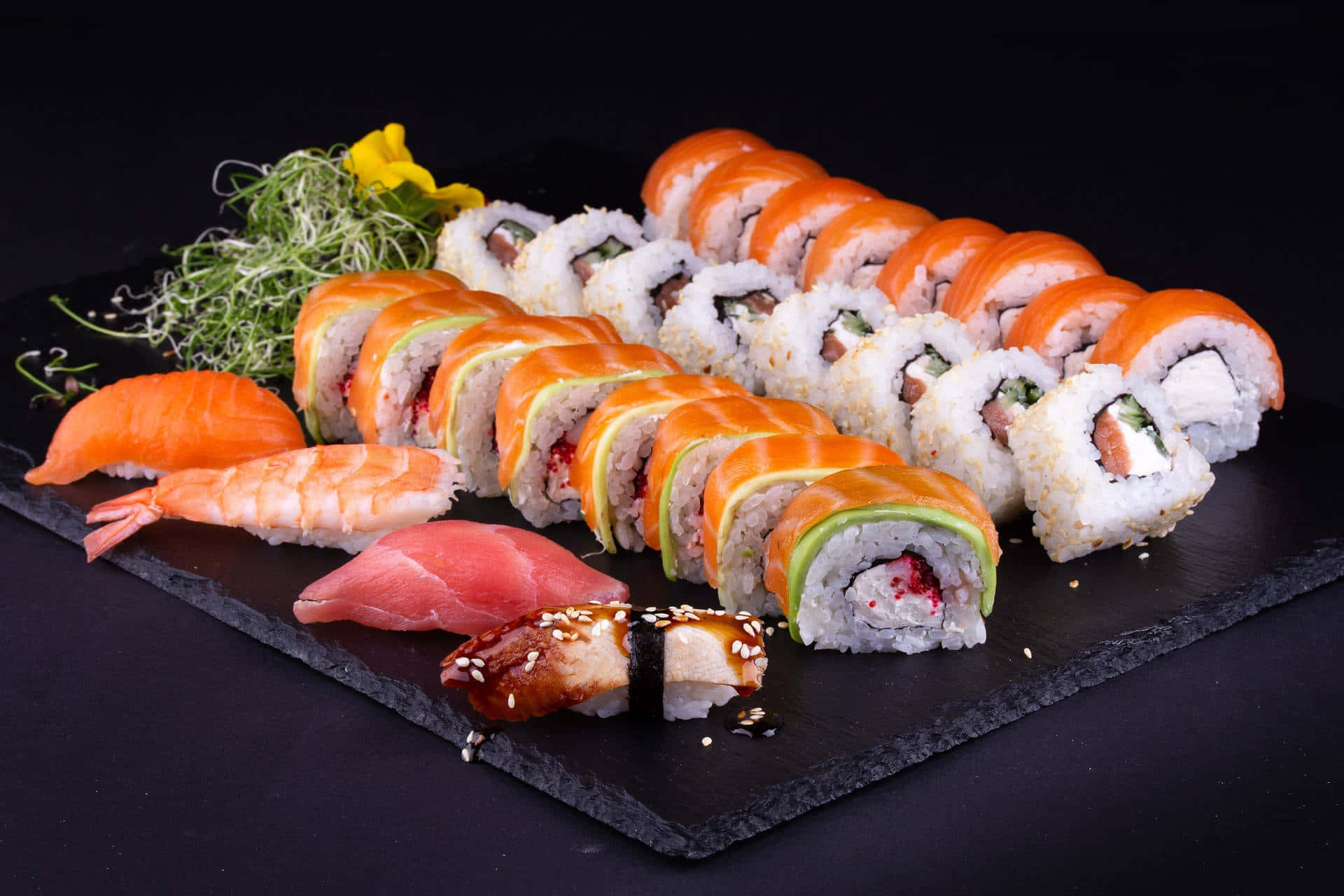 A delicious variety of sushi rolls beautifully arranged on a plate