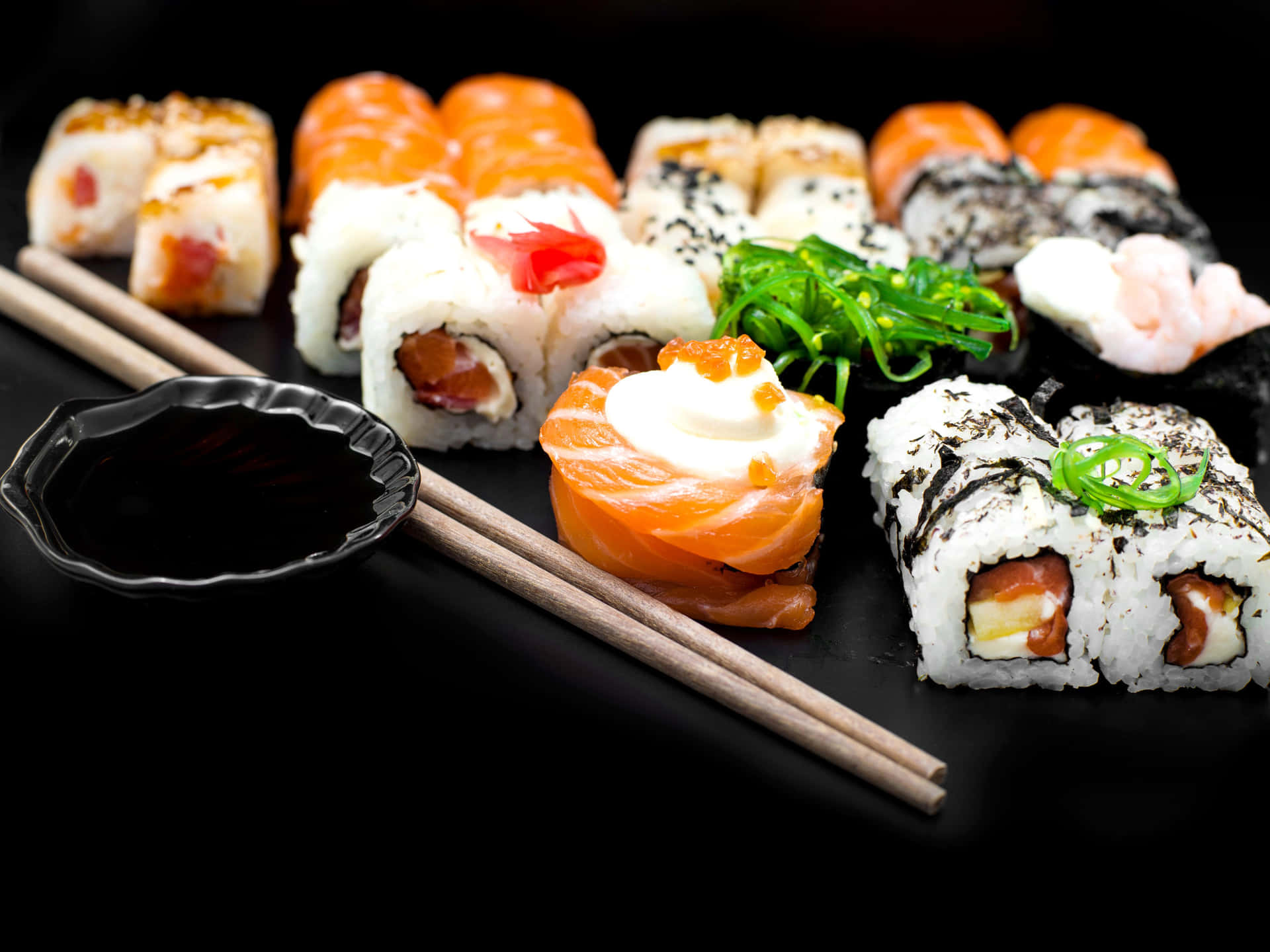 Delicious assortment of sushi on a wooden serving platter