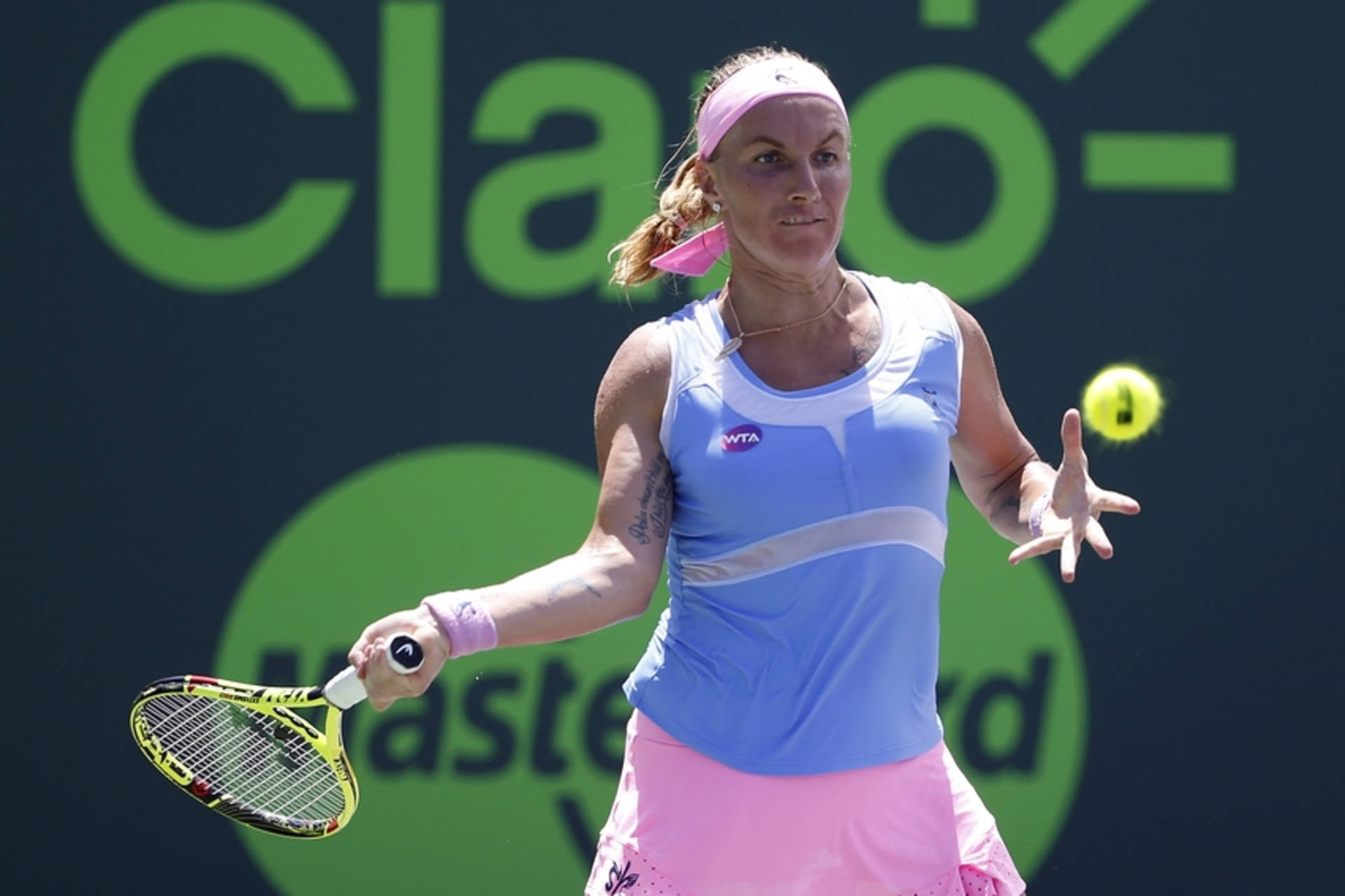Professional Tennis Player Svetlana Kuznetsova Performing Forehand Stroke Wallpaper