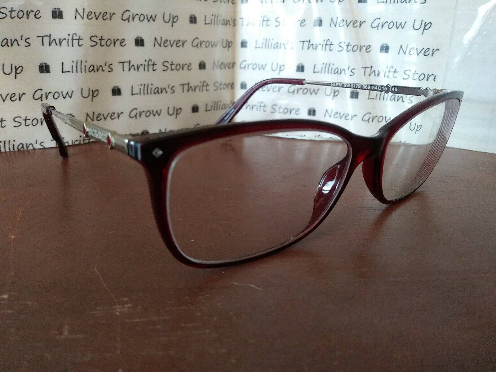 Swarovski Eyeglass Red Frames Wallpaper