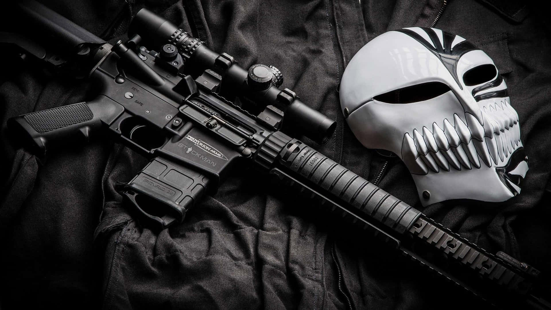 A Rifle And Mask On A Black Background Wallpaper