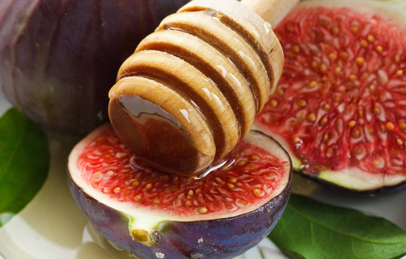 Fresh and Juicy Figs Immersed in Sweet Syrup Wallpaper