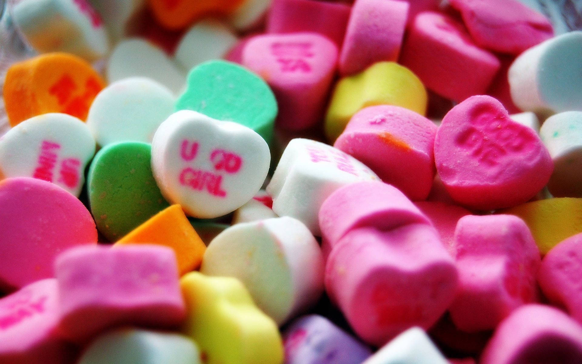 Sweet Heart-shaped Candies With Texts Wallpaper