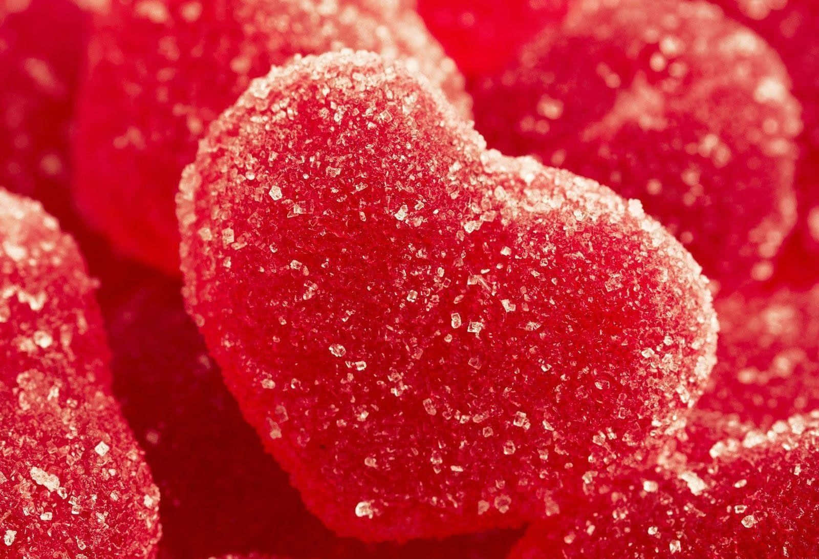 A Close Up Of Red Gummy Hearts