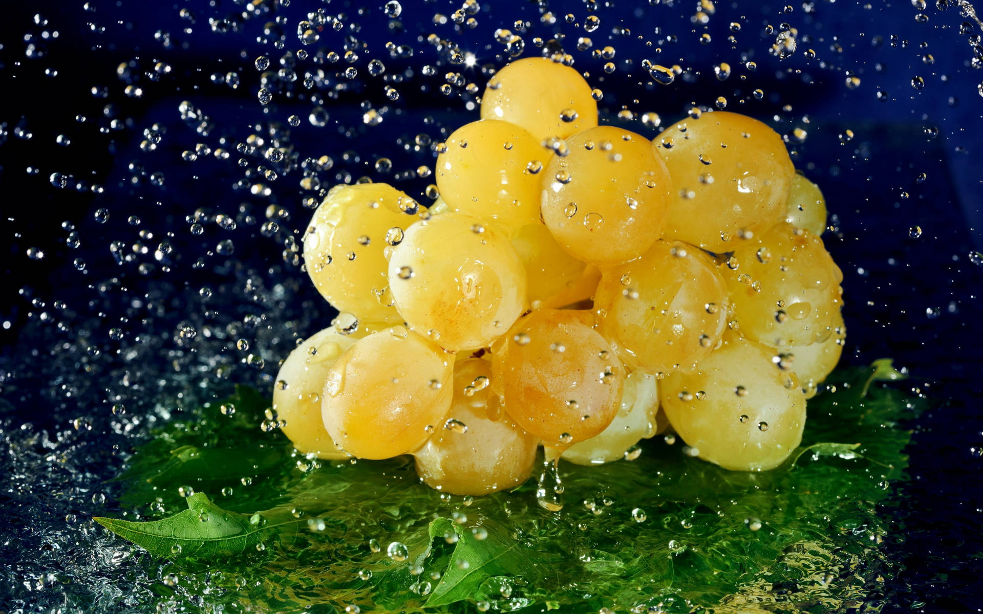 Vibrant Yellow Grapes Glistening on the Vine Wallpaper