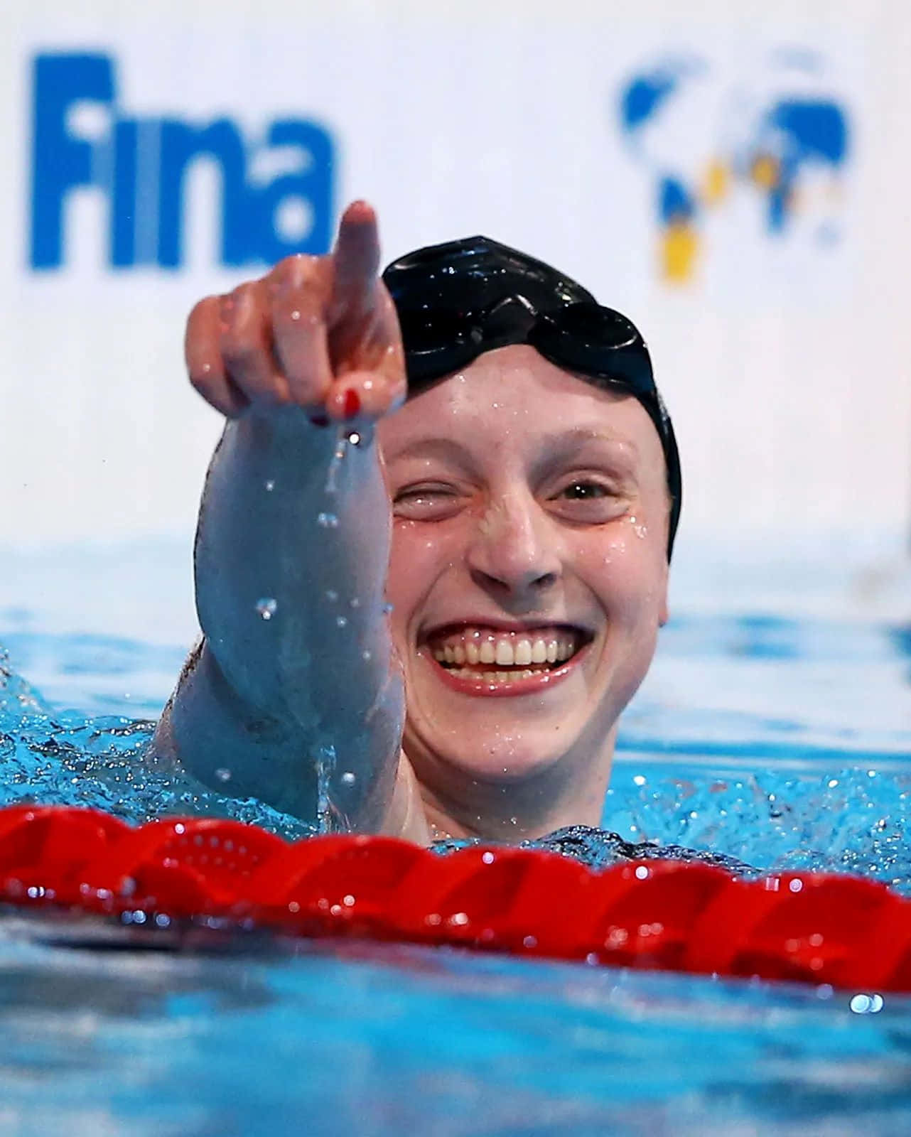 Swimmer Celebrating Victory Poolside Wallpaper