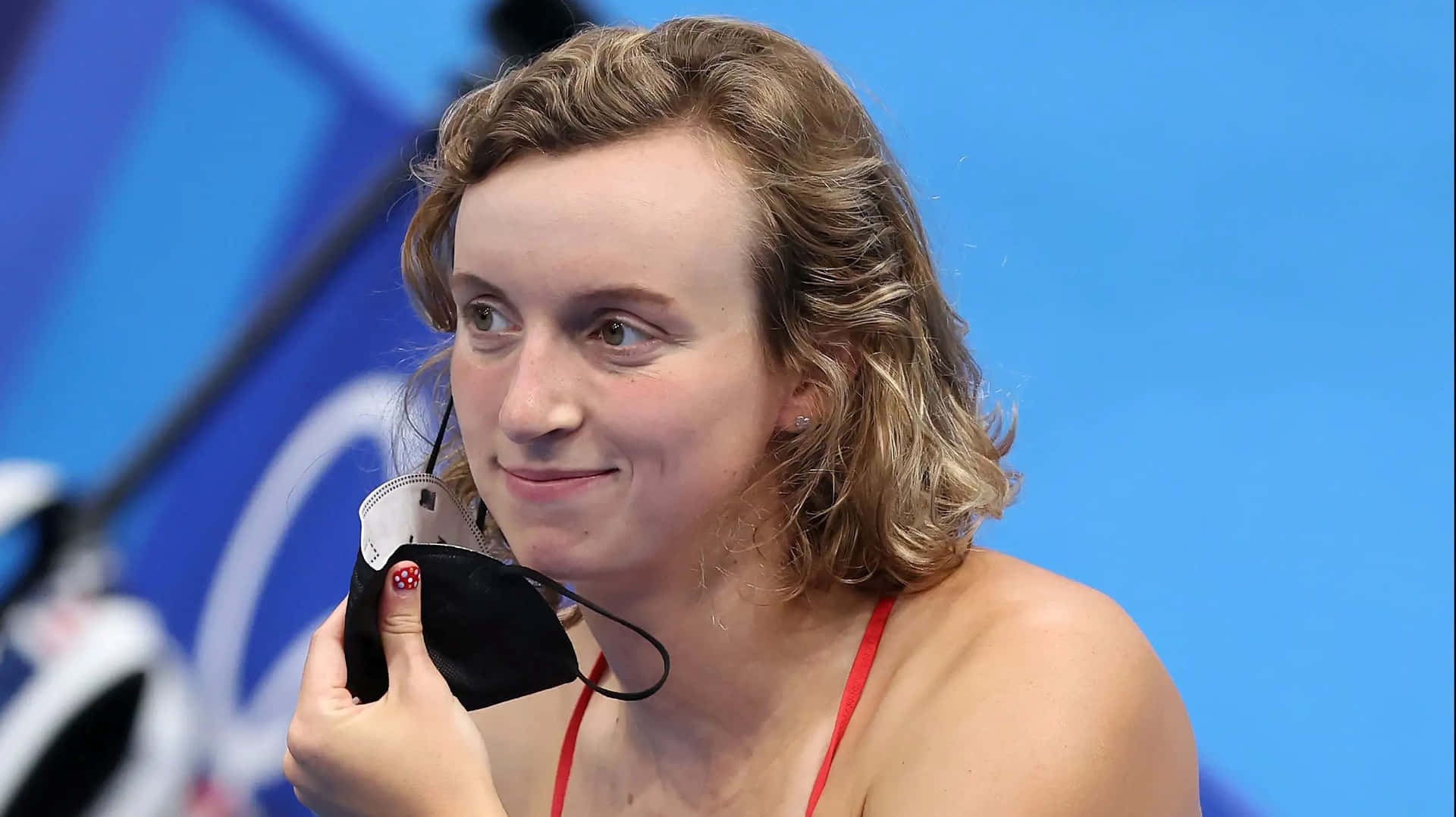 Swimmer Smiling With Medal Wallpaper