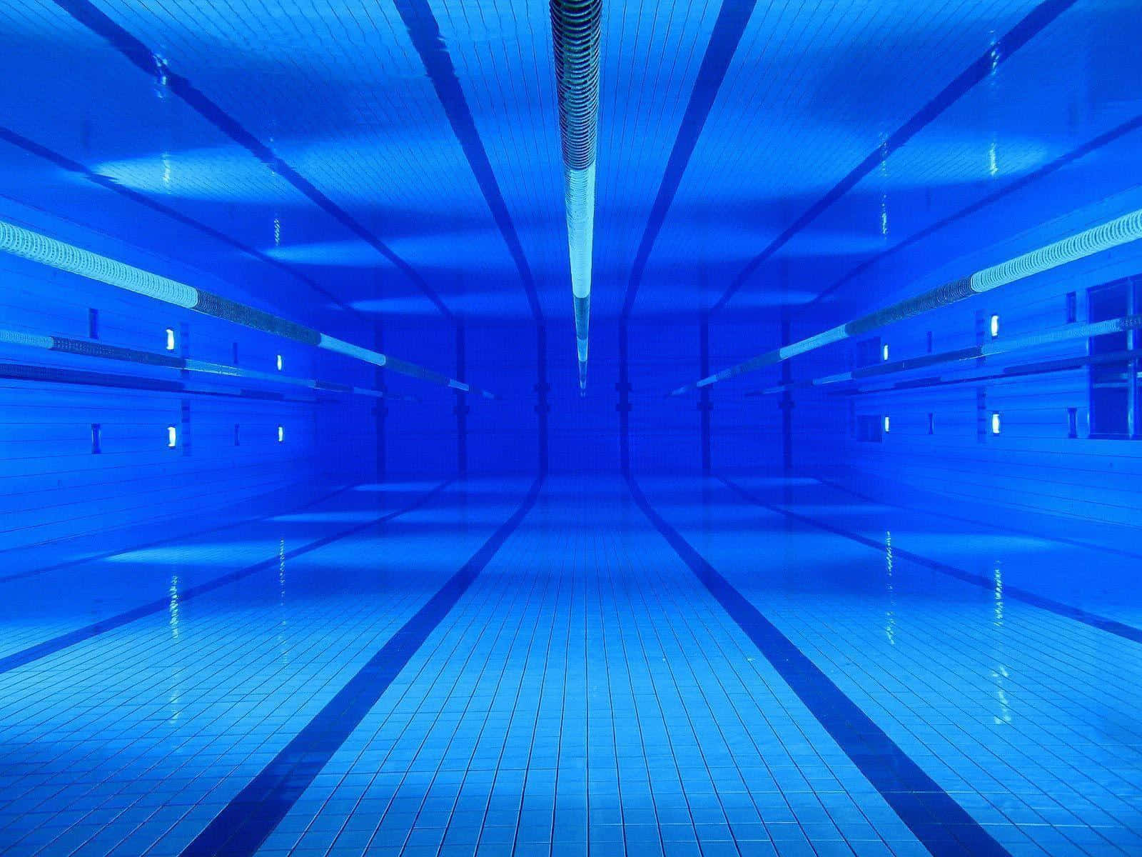 An Empty Swimming Pool With Blue Lights