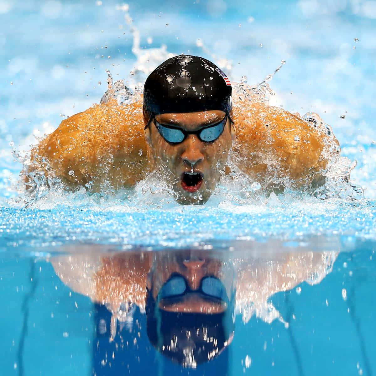 A Swimmer In The Water With Goggles On