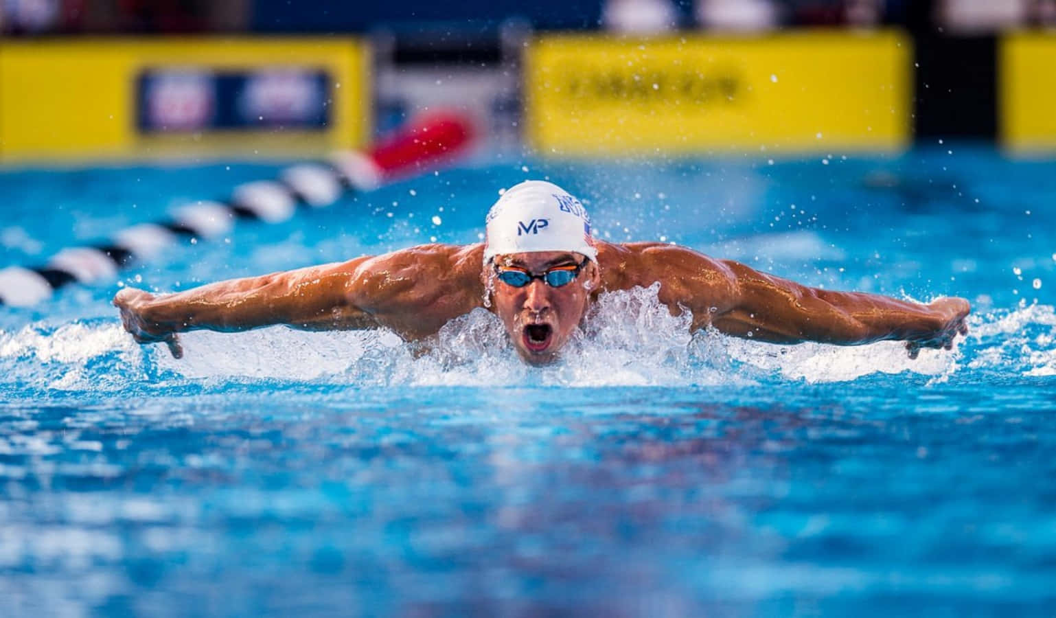 A Swimmer In The Water During A Competition