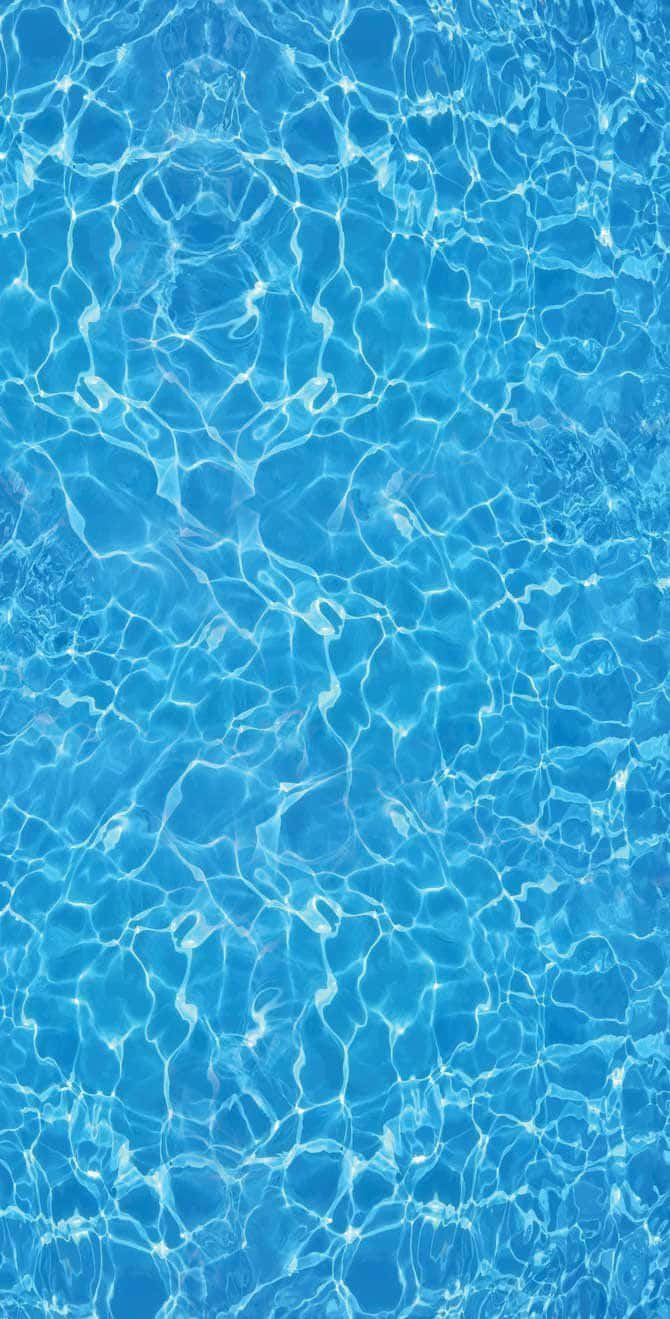 A Blue Swimming Pool With Water Ripples
