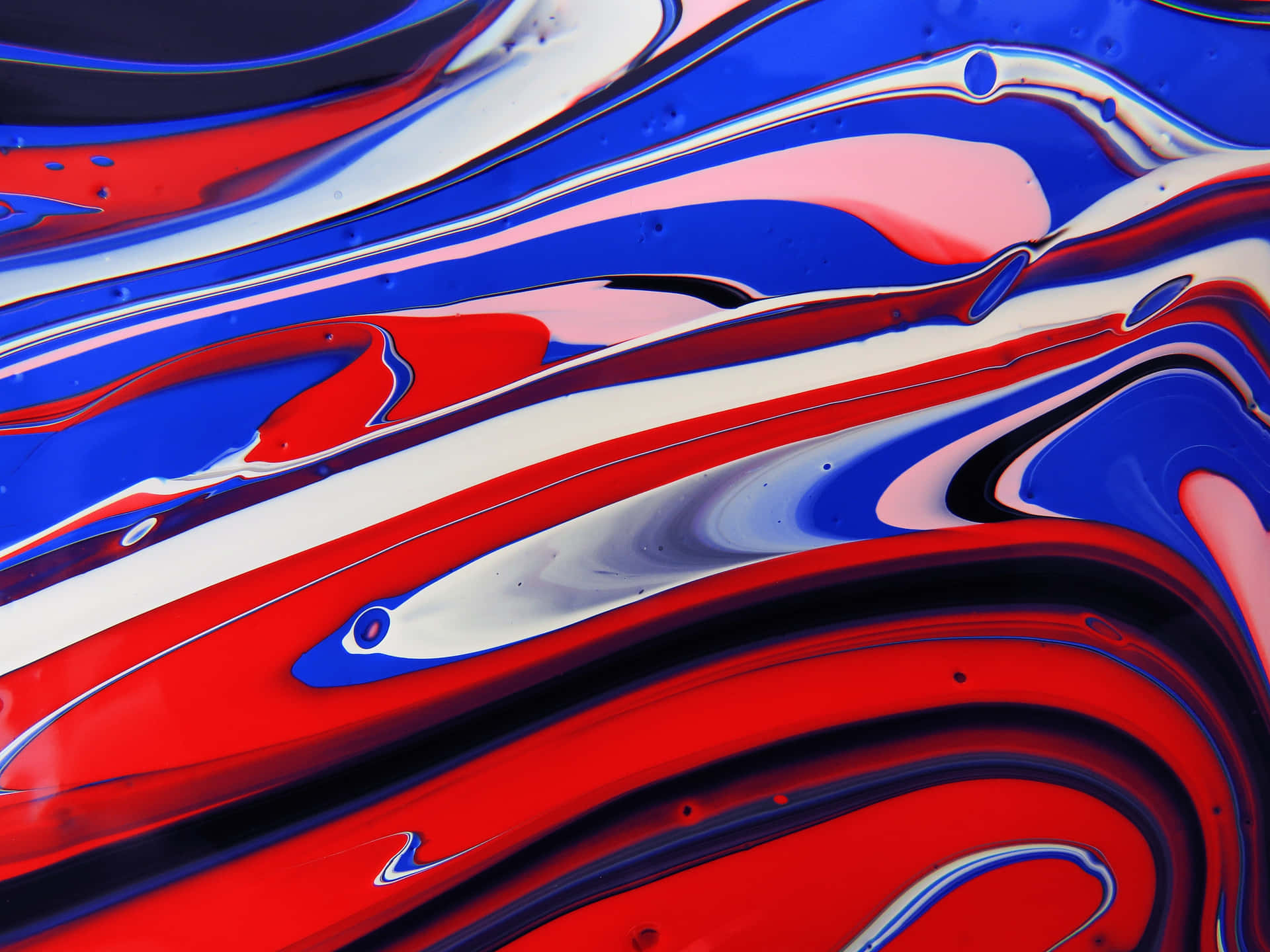 A Red, Blue, And White Swirl On A White Surface Wallpaper