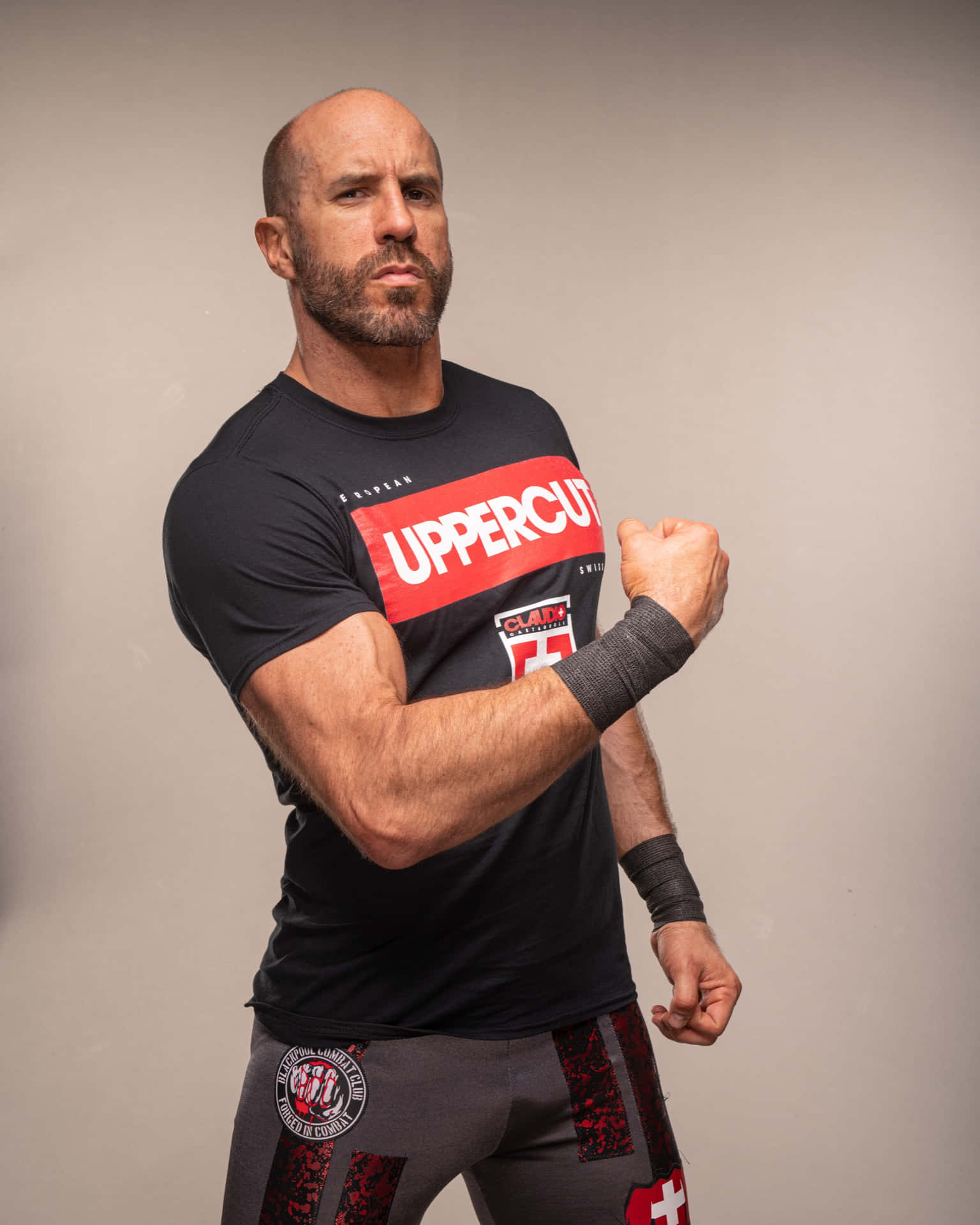 Swiss Professional Wrestler Claudio Castagnoli Black Uppercut Shirt Wallpaper
