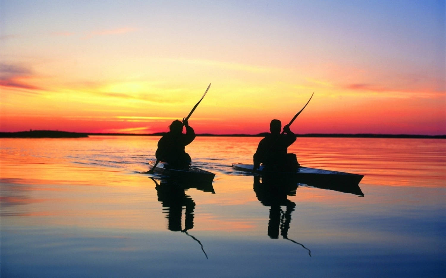 Synchronized Sunset Kayaking Wallpaper
