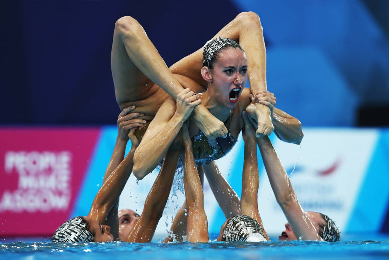 Synchronized Swimming Performance at the Olympics Wallpaper