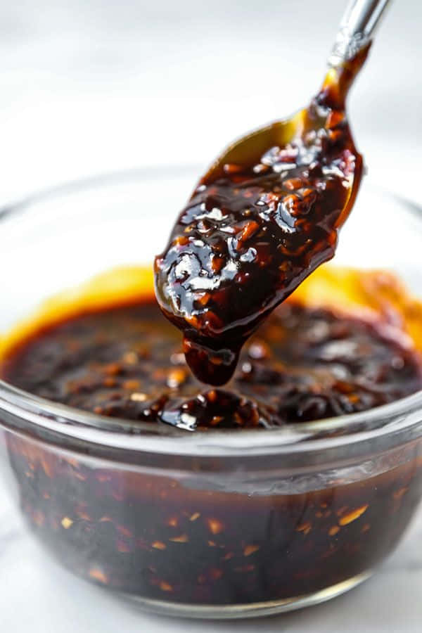 Delicious Homemade Szechuan Sauce in a Glass Bowl Wallpaper