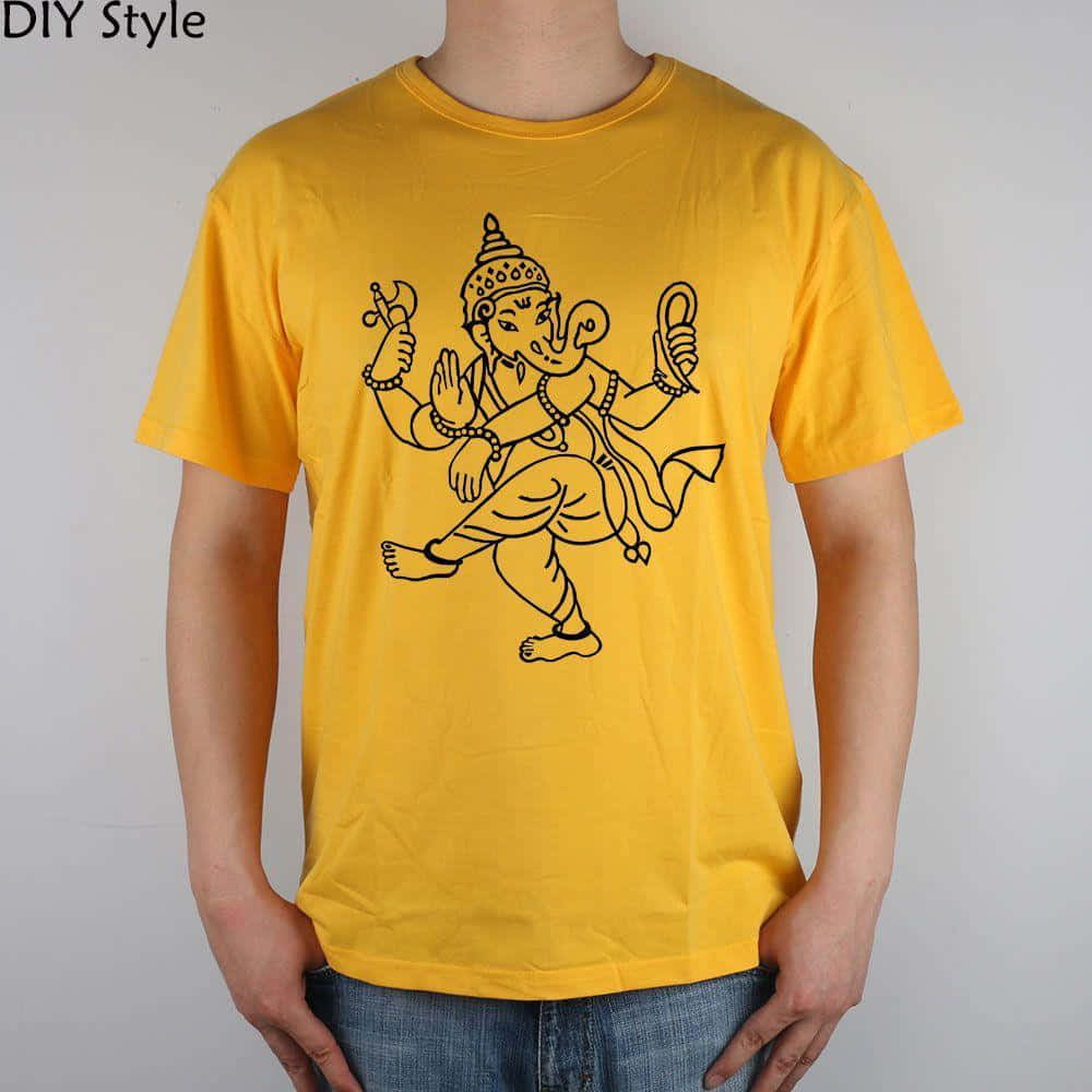 A Man Wearing A Yellow T - Shirt With An Image Of Ganesha