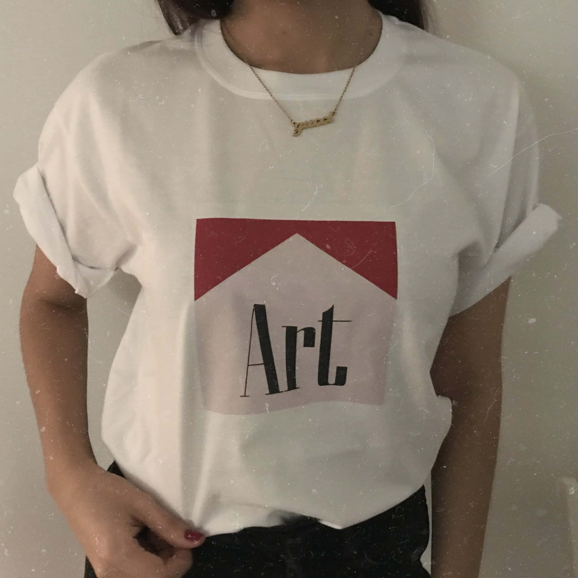 A Woman Wearing A White T - Shirt With The Word Art On It