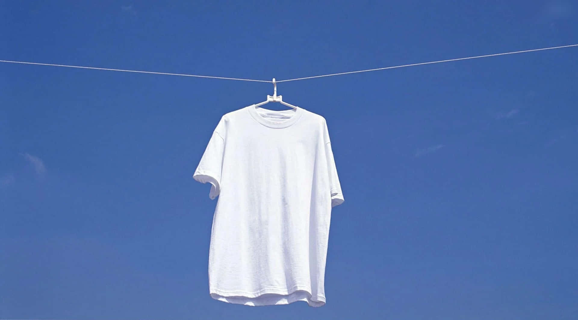 White Shirt Hanging On Clothes Line