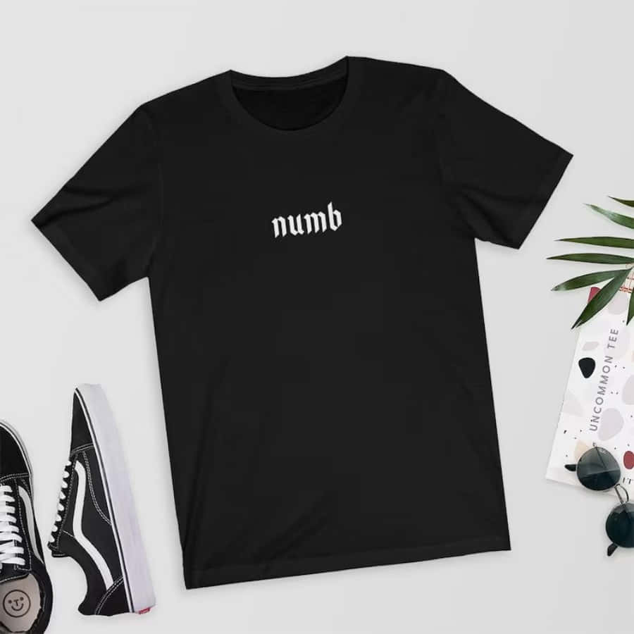 A Black T - Shirt With The Word Numb On It