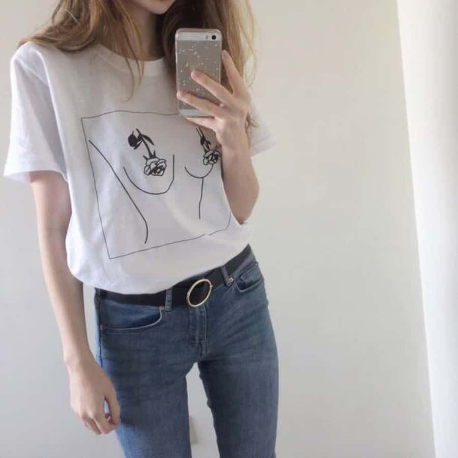 A Woman Wearing A White T - Shirt And Jeans