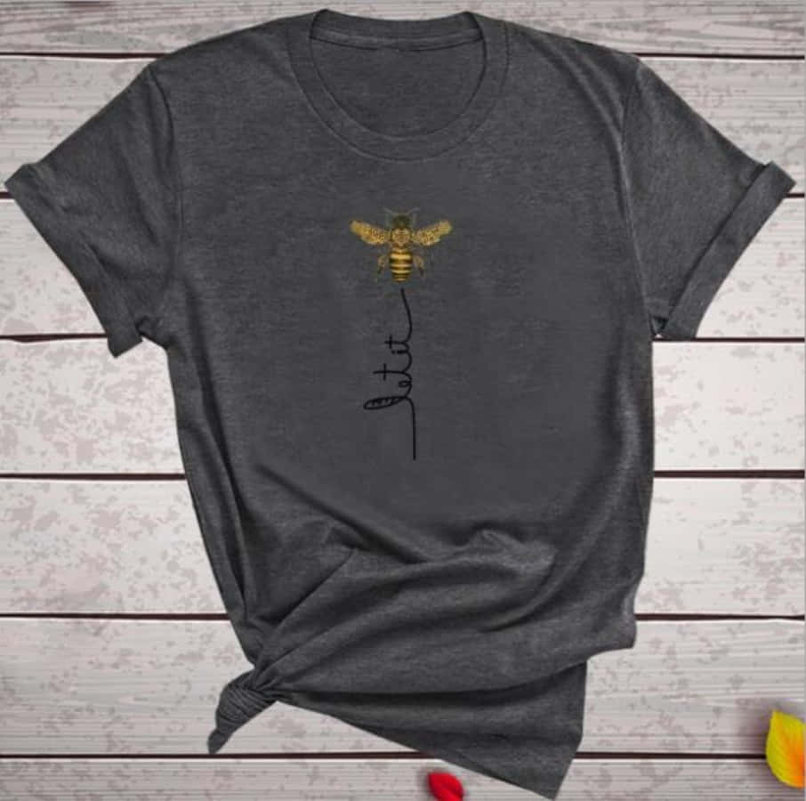 A Bee With A Gold Arrow On A Gray T - Shirt