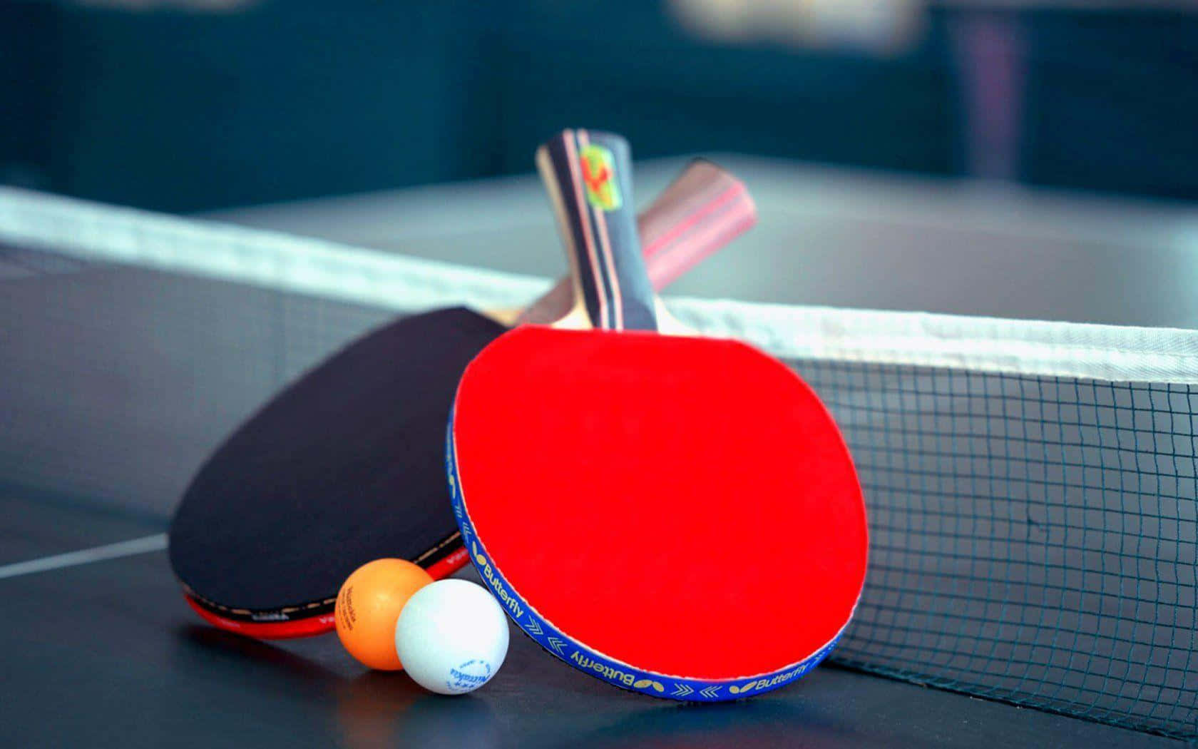 Ping Pong Paddles And Balls On A Table