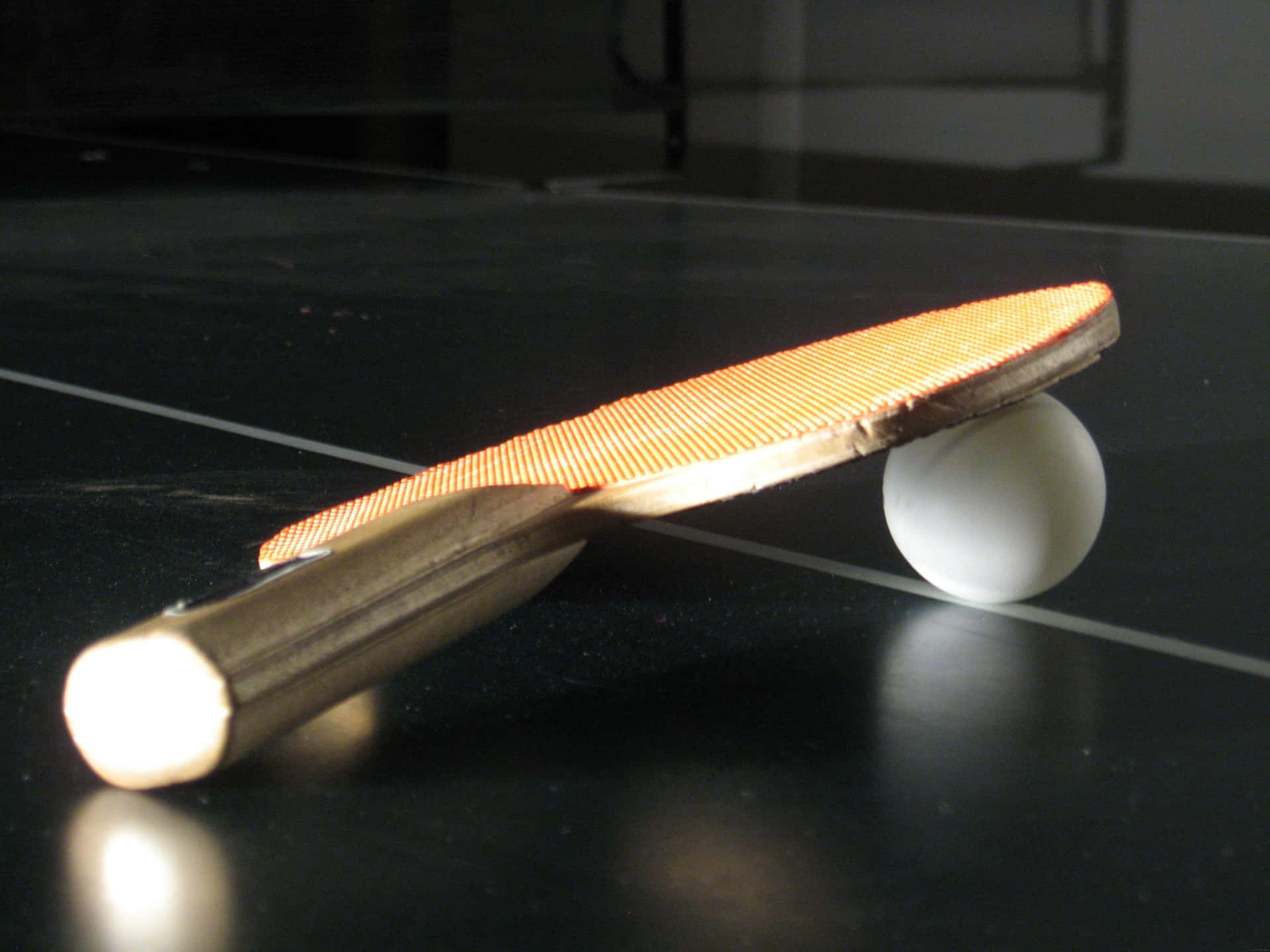 A Ping Pong Paddle On A Table