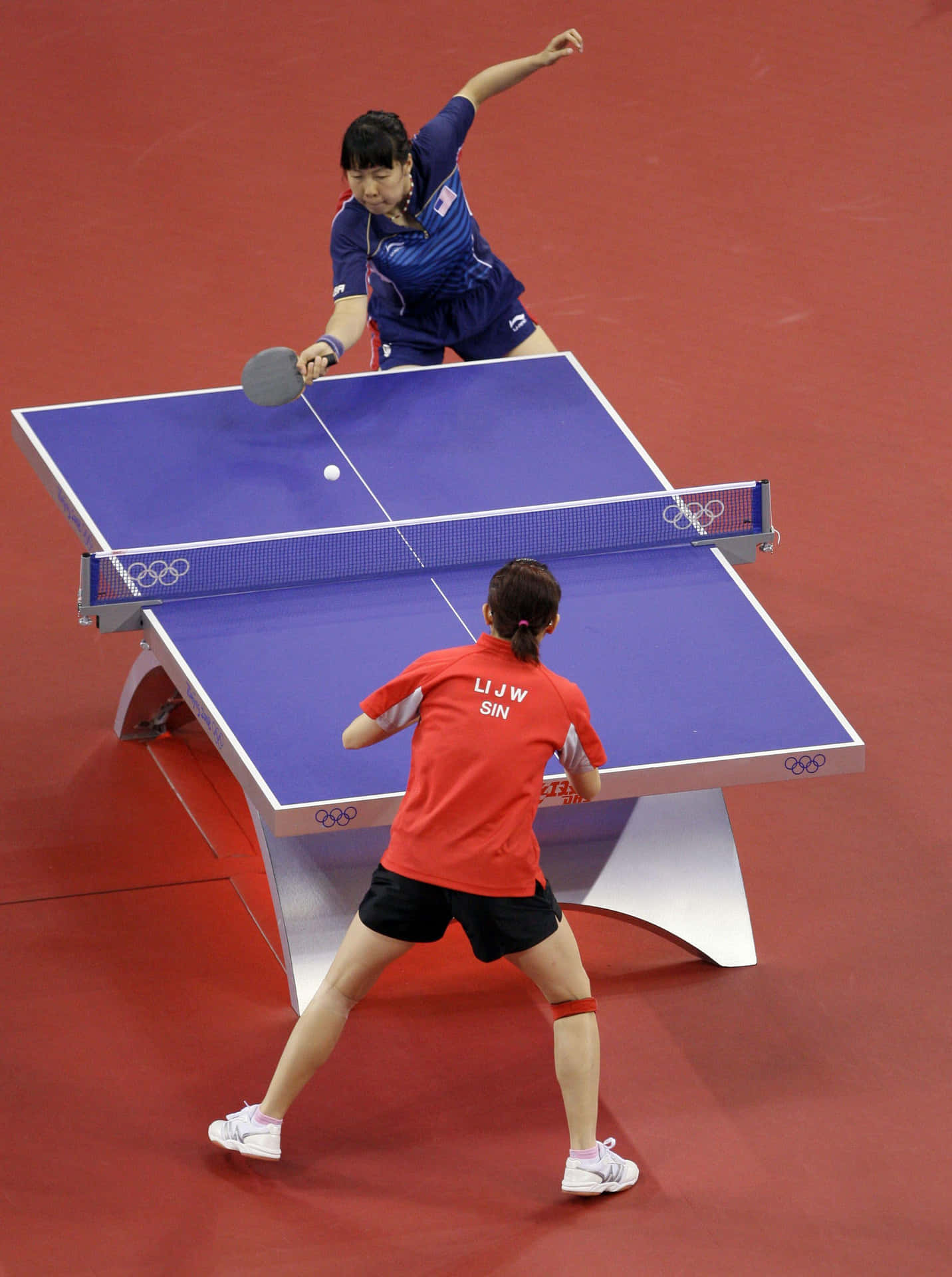 Two People Playing Ping Pong