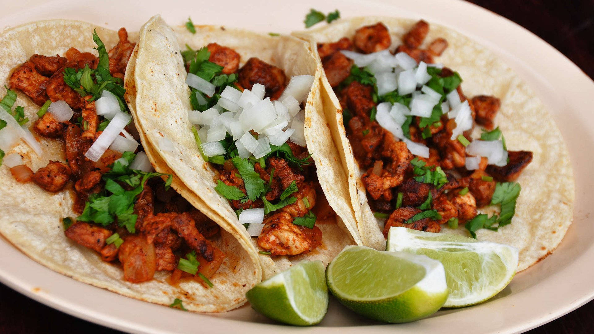 Tempting Tacos Al Pastor with Freshly Chopped Lime Wallpaper