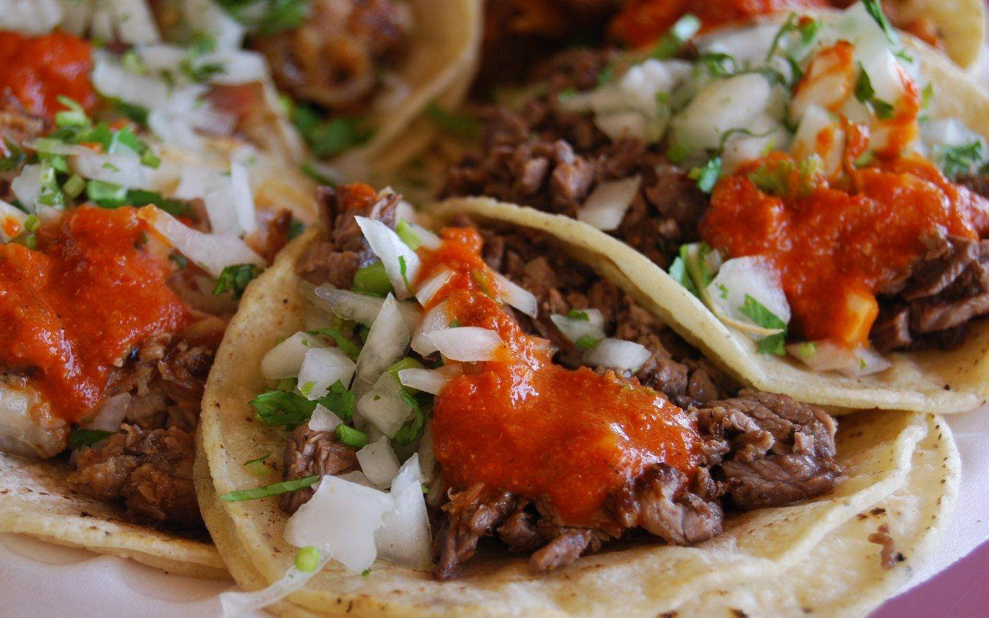 Tantalizing Tacos Al Pastor with Vibrant Spicy Salsa Wallpaper