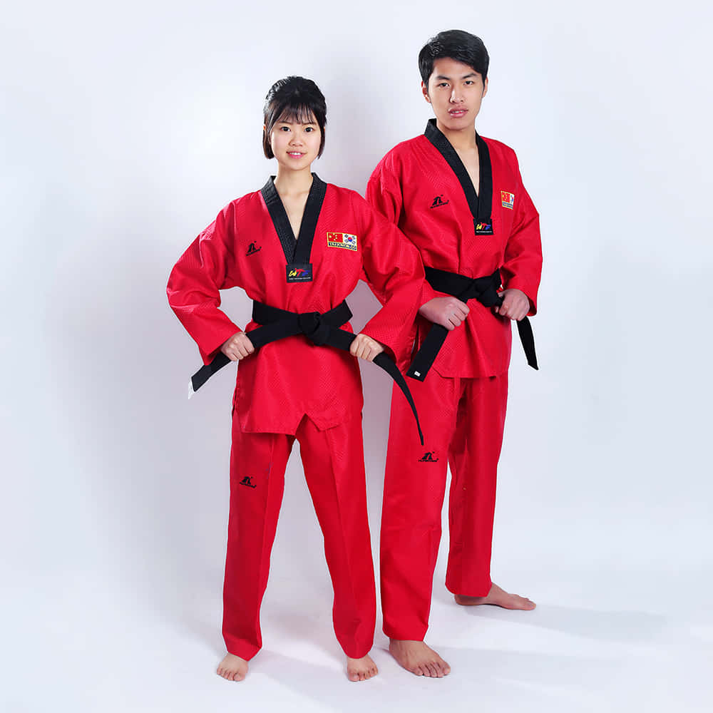 Get Ready for The Fight - A Man Wearing a Taekwondo Uniform Wallpaper
