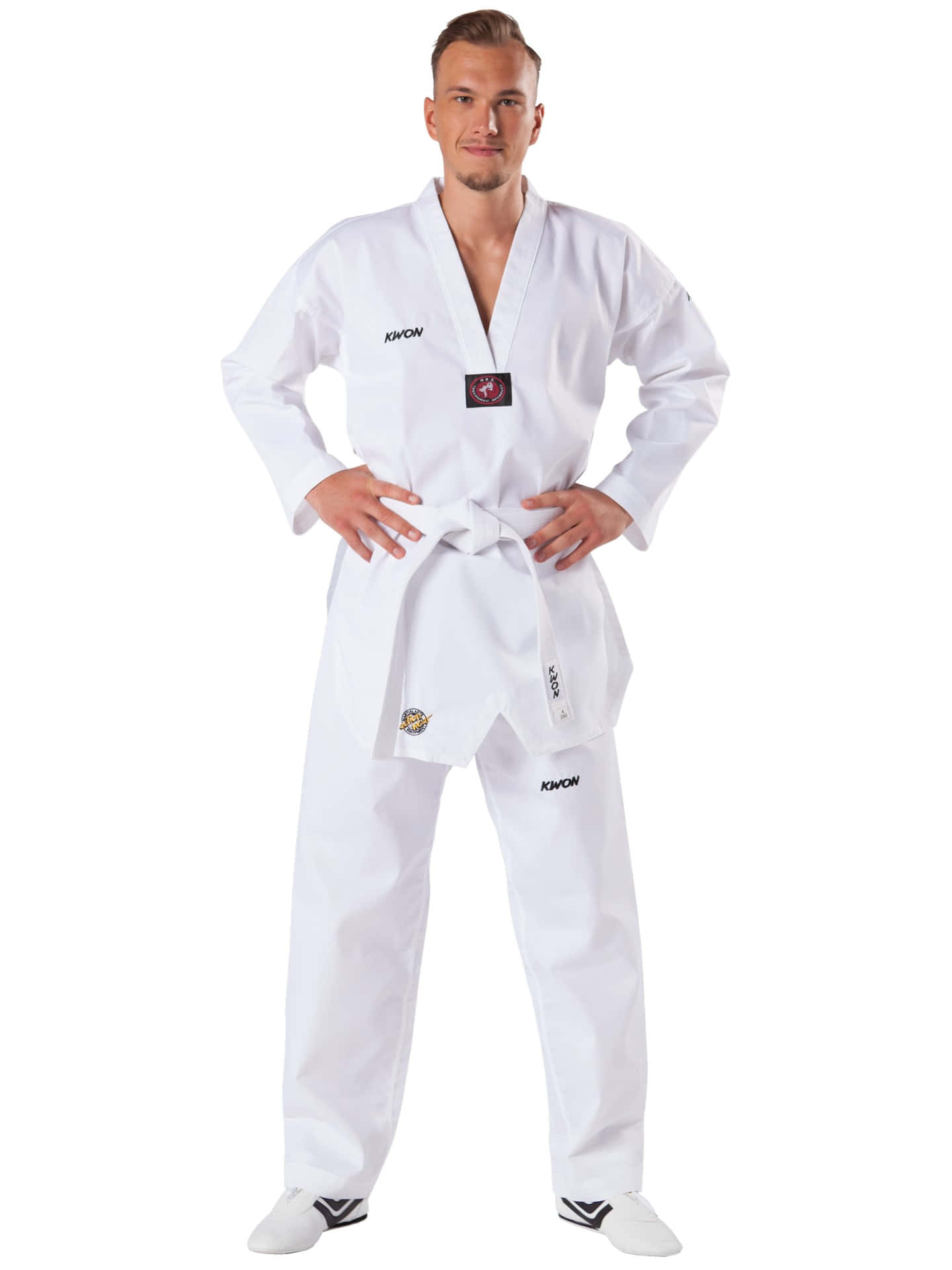 A young martial artist wearing a traditional Taekwondo uniform Wallpaper