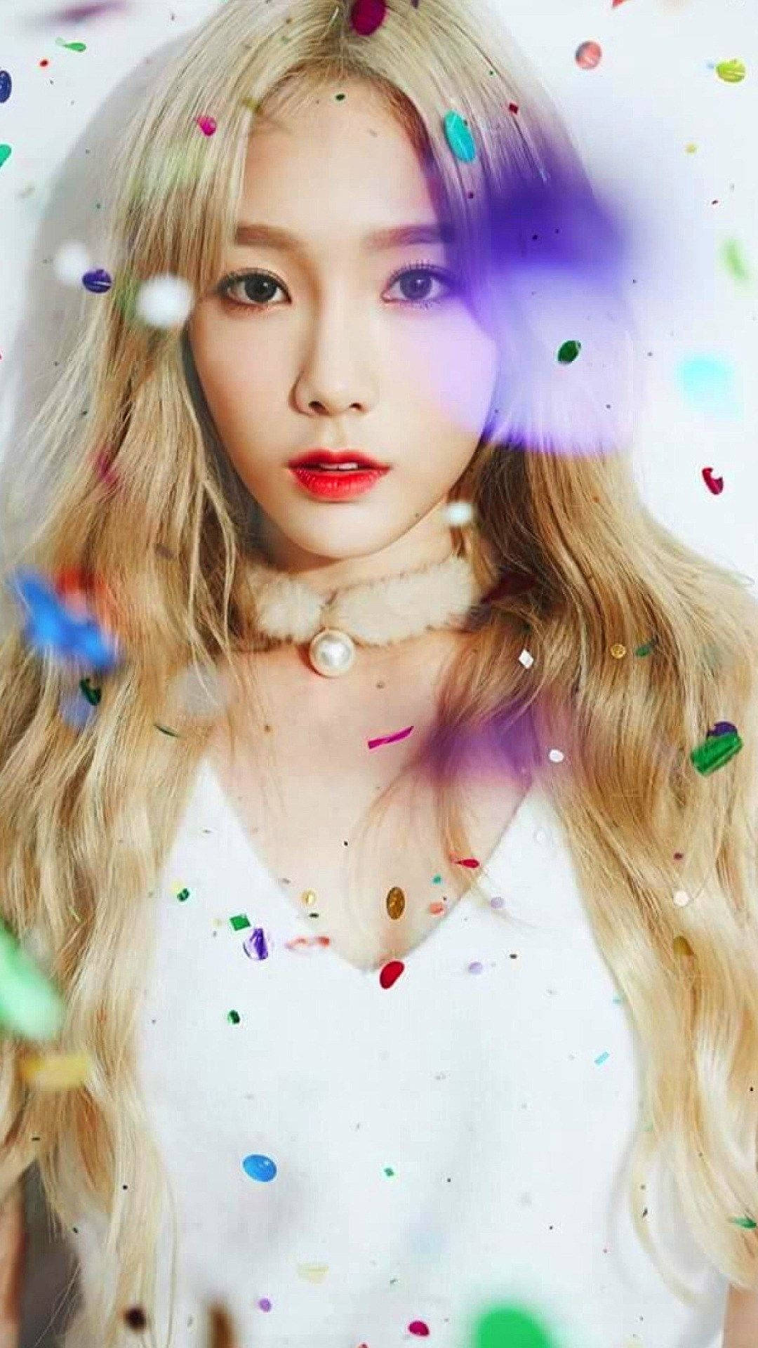 K-pop sensation Taeyeon reveling under vibrant confetti Wallpaper