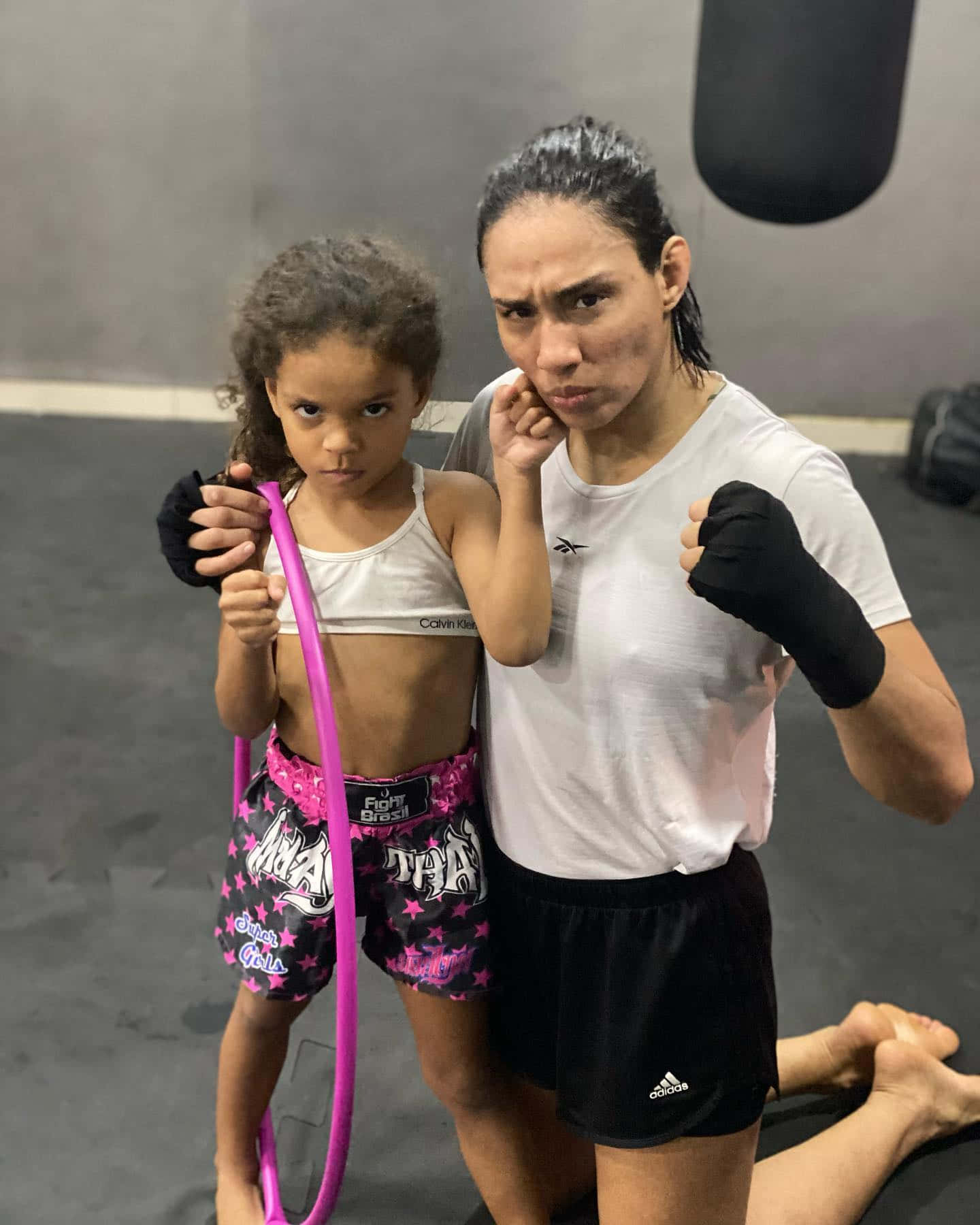 Taila Santos And Daughter At Training Facility Background