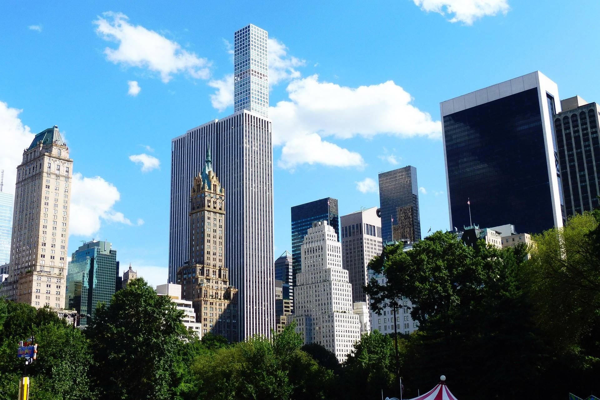 Tall Buildings Looming Over Central Park Wallpaper