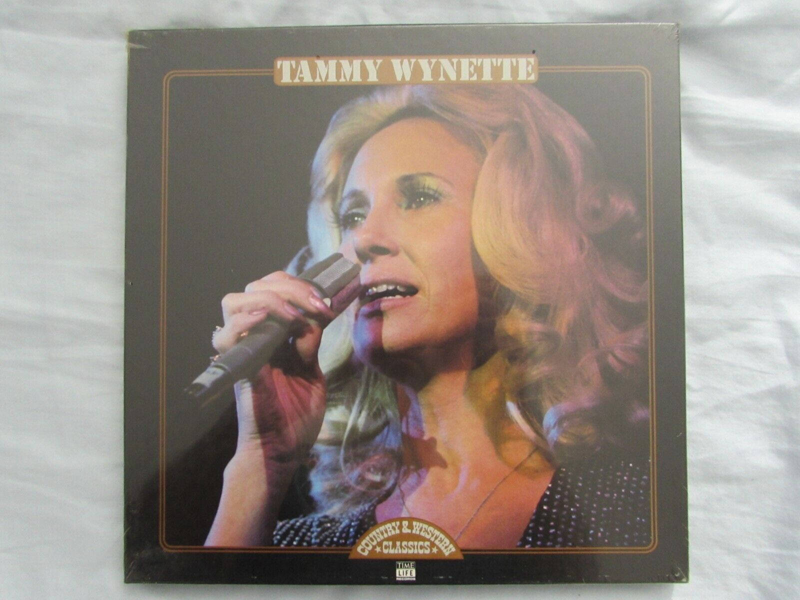 Legendary Country Artist Tammy Wynette with her Classic Album Wallpaper