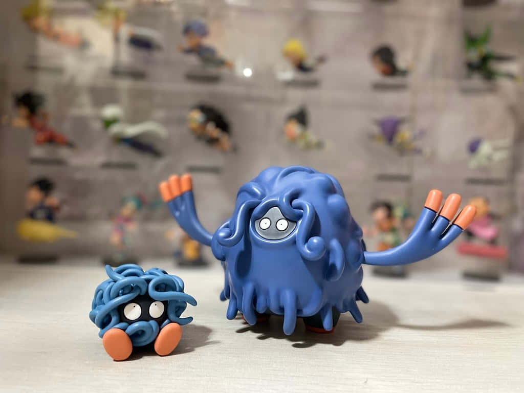 Tangela And Tangrowth Action Figures Wallpaper