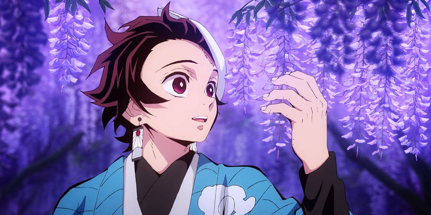 Tanjiro embraces the beauty of wisteria flowers Wallpaper