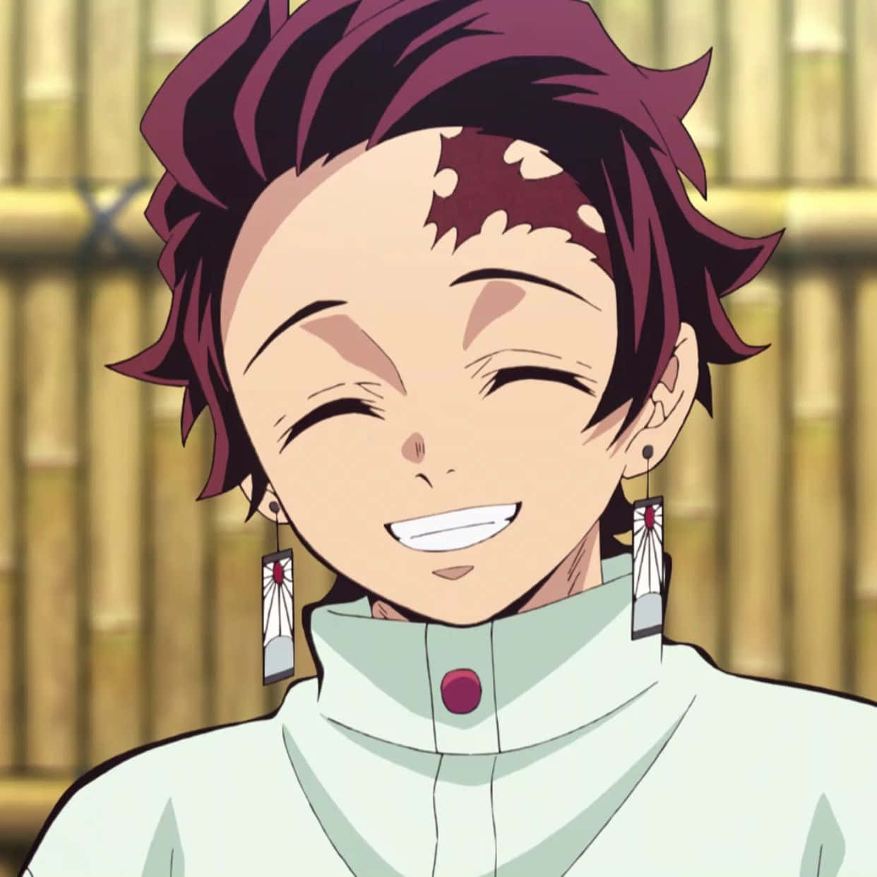 A Girl With Red Hair And Earrings Is Smiling
