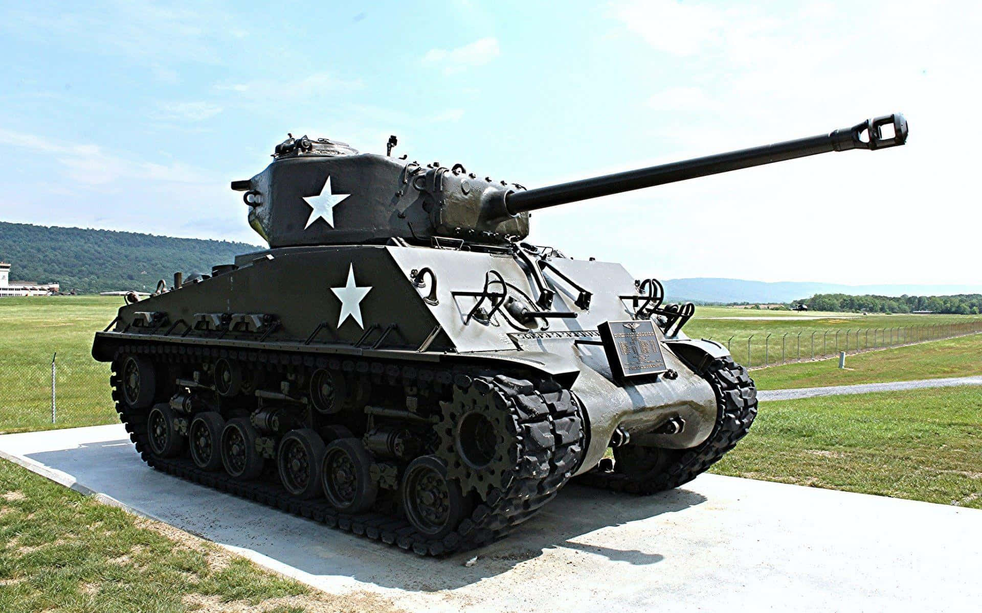 A Military Tank Rolls Through the Battlefield