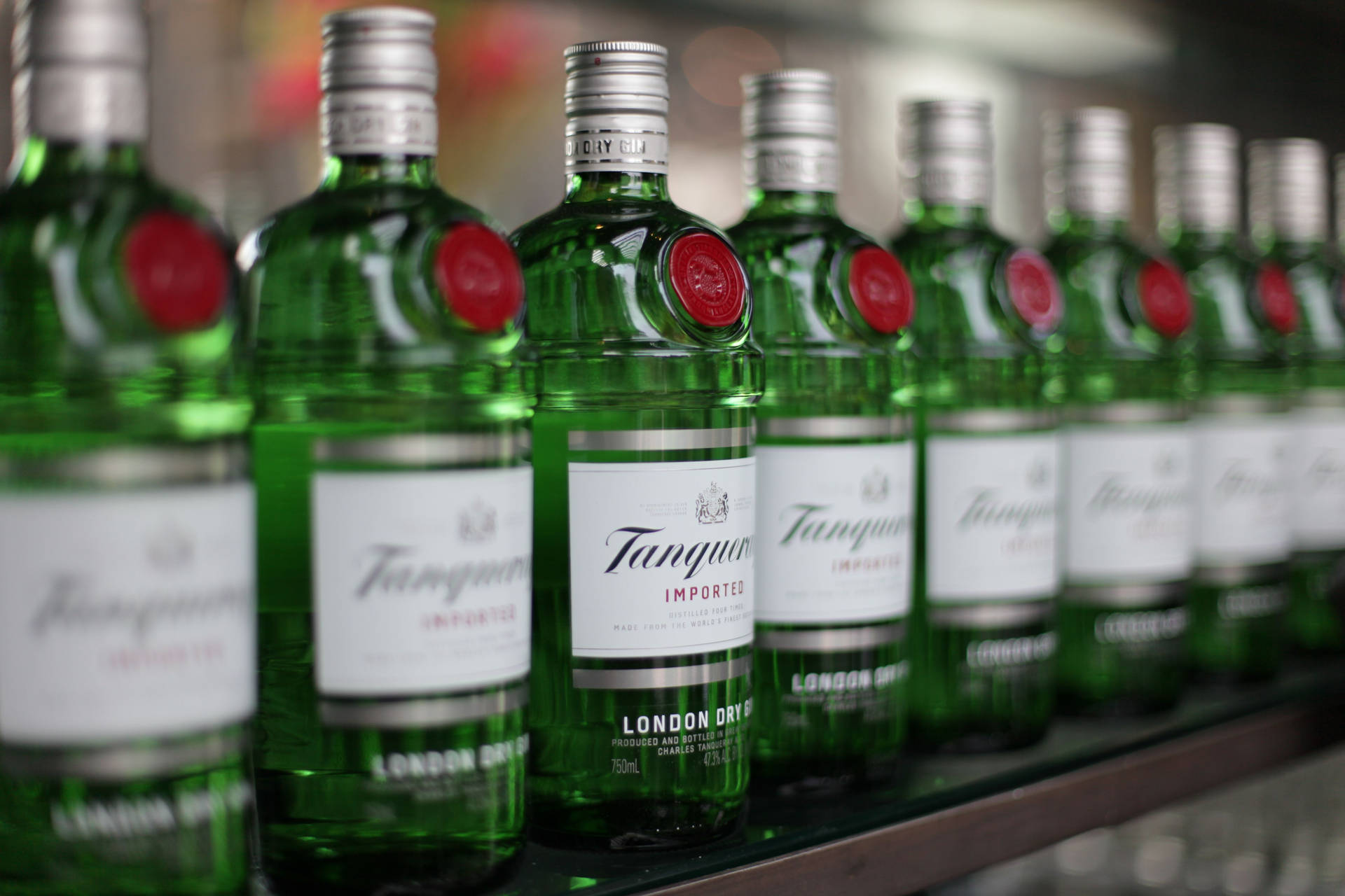 Tanqueray Gin Bottles Lined Up Wallpaper