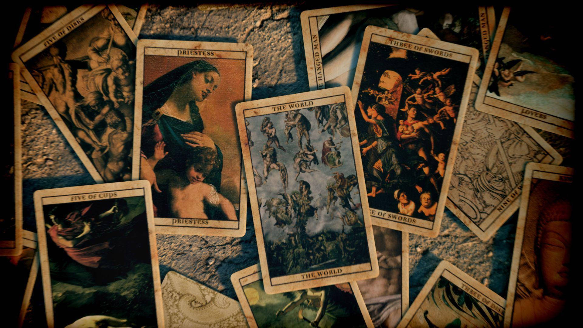 A Group Of Tarot Cards Are Arranged On A Table Wallpaper