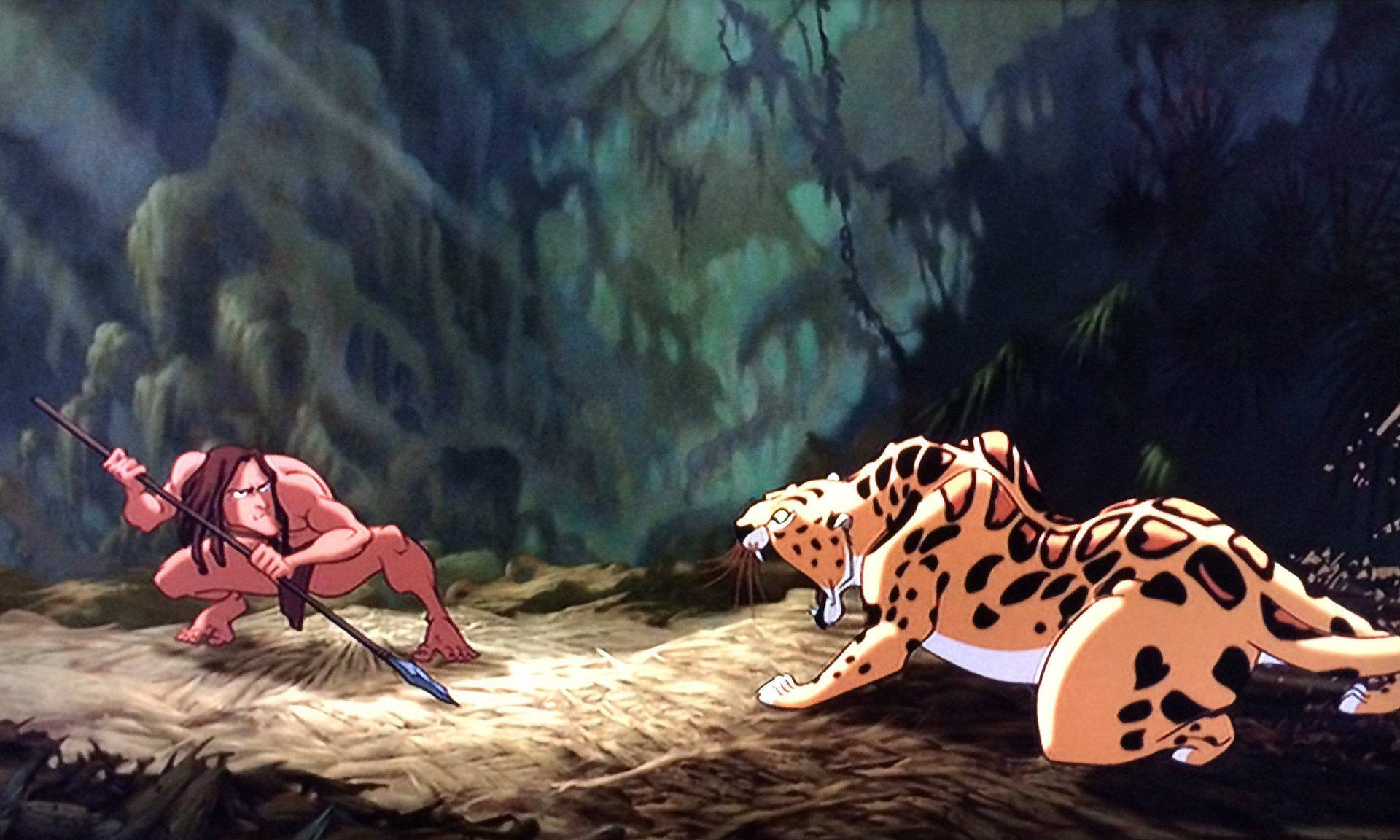 Tarzan Fighting Off A Tiger Wallpaper