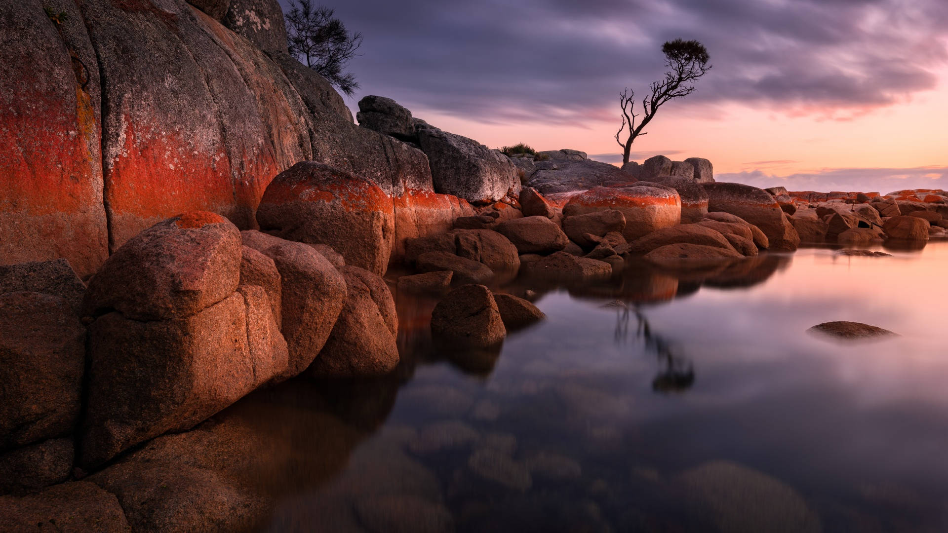 Tasmania Rocks Next To Lake Wallpaper