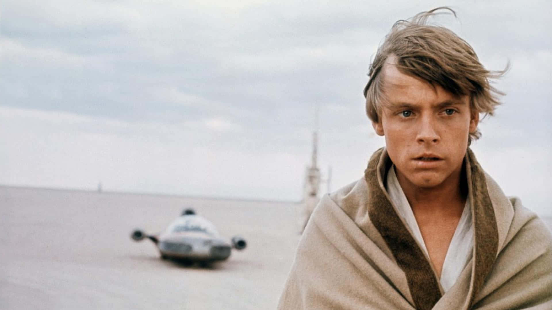 Luke In Blanket Tatooine Background